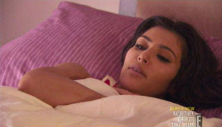 Illustration for article titled Kim Kardashian Gets Wasted, Pukes